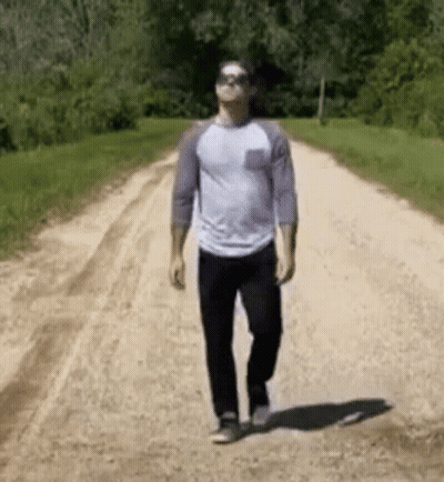Man Walking Dirt Road With Sunglasses GIF