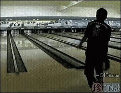 Man Walking Down Bowling Alley GIF
