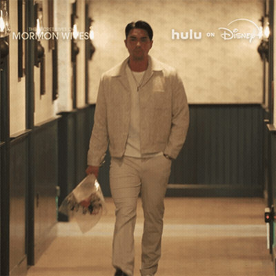 Man Walking Down Hallway With Flowers The Secret Lives Of Mormon Wives GIF
