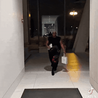 Man Walking Down Hallway With TikTok Sticker GIF