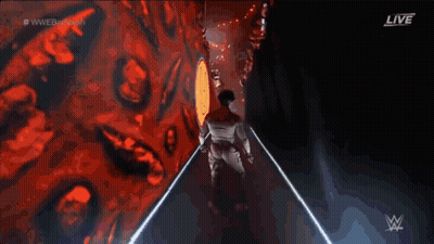Man Walking Down Hallway With WWE Logo GIF