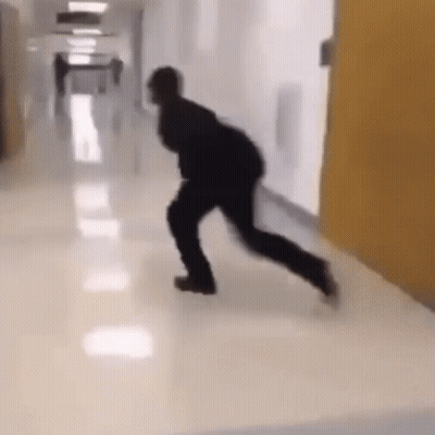 Man Walking Down Hospital Hallway GIF