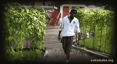 Man Walking Down Path With Sekamoke.org GIF