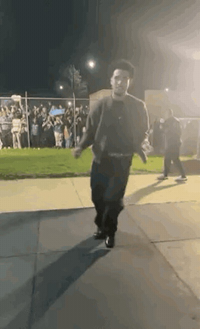 Man Walking Down Sidewalk GIF