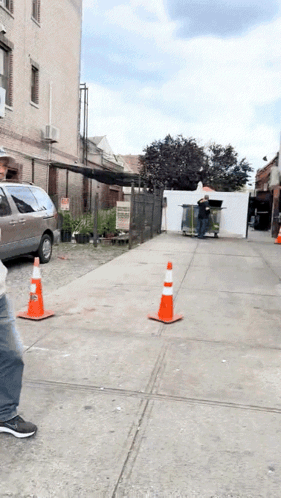 Man Walking Down Sidewalk With Van