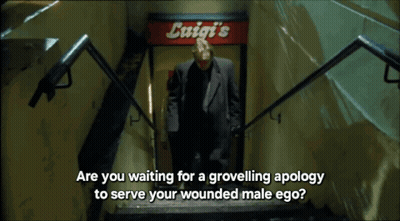 Man Walking Down Stairs With Exit Sign GIF