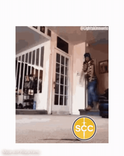 Man Walking Down Stairs With SCC Logo In Living Room GIF