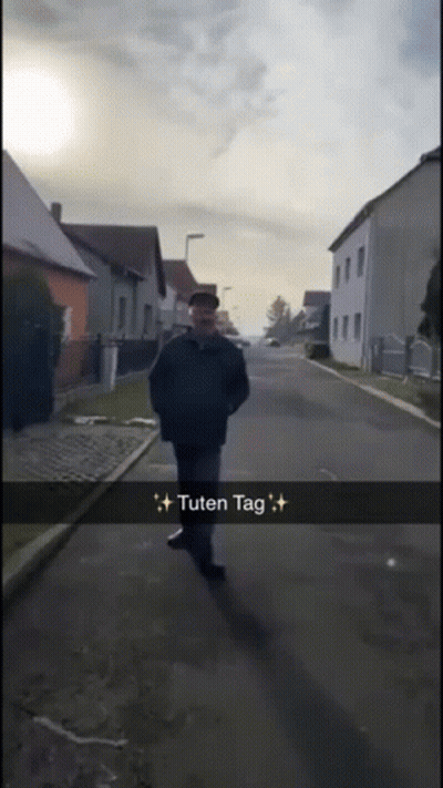Man Walking Down Street Saying Tuten Tag GIF