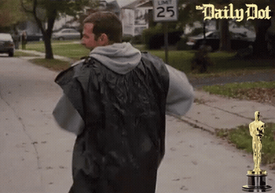 Man Walking Down Street With Sign Saying 25 GIF