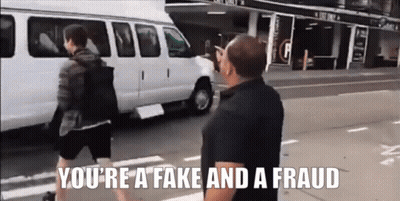 Man Walking Down Street Youre Fake And Fraud GIF