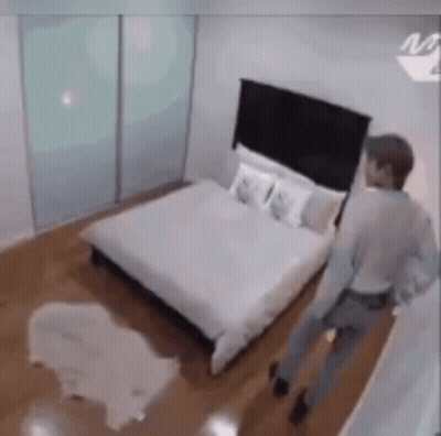 Man Walking In Bedroom GIF