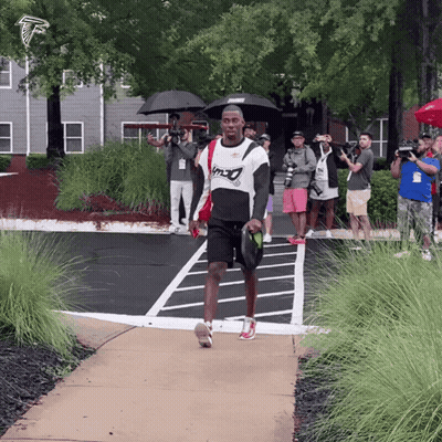Man Walking In Falcons Shirt GIF