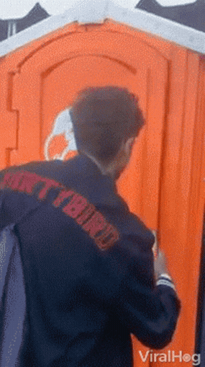 Man Walking In Front Of Blue Pixi Toilets GIF