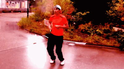 Man Walking In Red Shirt And Black Pants GIF