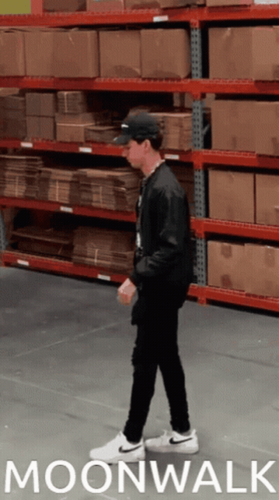 Man Walking In Warehouse Moonwalk GIF