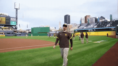 Man Walking On Baseball Field With Light Sign GIF