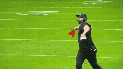 Man Walking On Football Field With Microphone And Helmet GIF