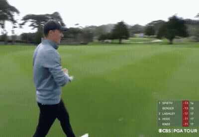 Man Walking On Golf Course With CBS PGA Tour Scoreboard GIF