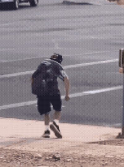 Man Walking On Sidewalk GIF