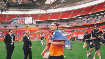Man Walking On Soccer Field Holding AOL Flag GIF