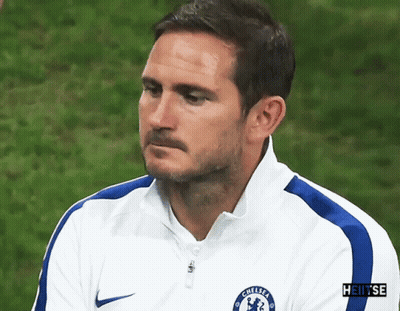 Man Walking On Soccer Field In Front Of Heineken And Nissan Sign GIF