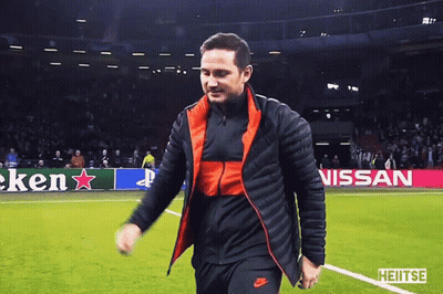Man Walking On Soccer Field In Front Of Heineken Nissan Sign GIF