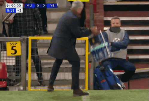 Man Walking On Soccer Field With Water Bottle GIF