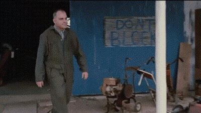 Man Walking Past Don't Block Sign GIF