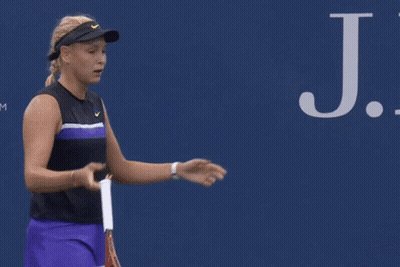 Man Walking Past Ford Ad On Tennis Court GIF