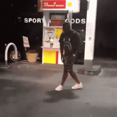 Man Walking Past Gas Pump Saying Sport Goods GIF