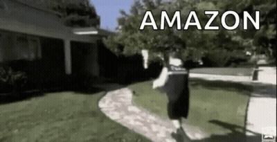 Man Walking Past House With Amazon Sign GIF