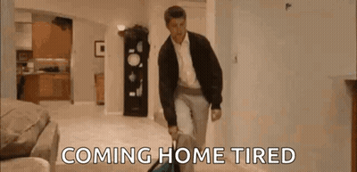 Man Walking Through Living Room With Suitcase Coming Home Tired GIF