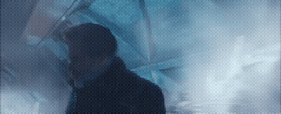 Man Walking Through Smoke-Filled Room