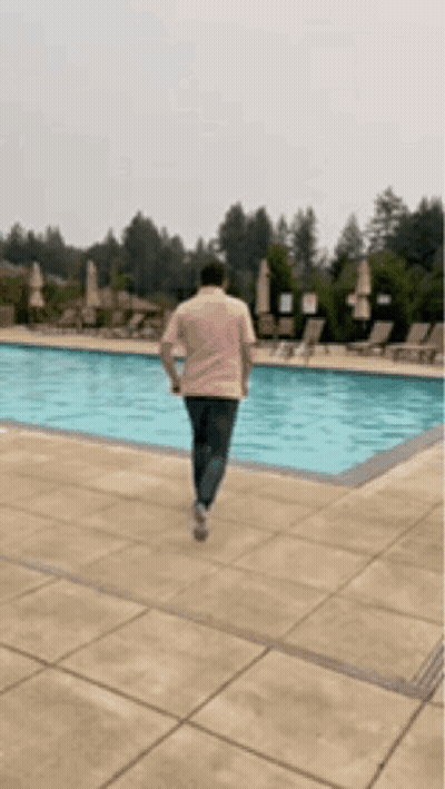 Man Walking Towards Pool GIF