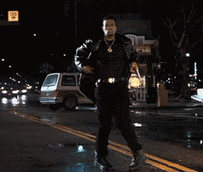 Man Walking With Arms Outstretched Past No Parking Sign GIF