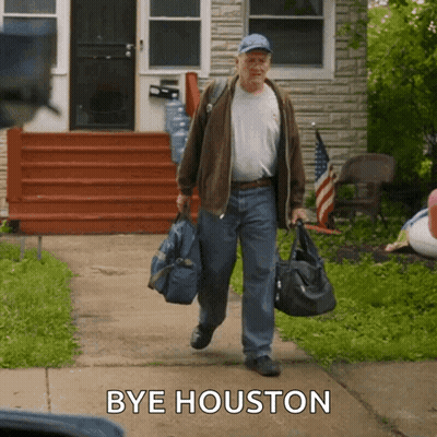 Man Walking With Bag Saying Bye Houston GIF