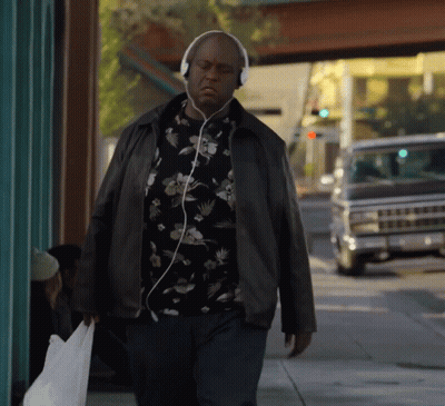 Man Walking With Headphones GIF