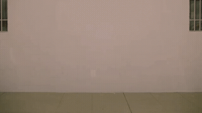 Man Walking With Link City Sign GIF
