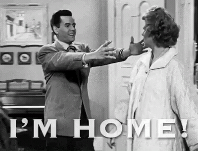 Man Walking With Suitcase Saying Hi Honey I'm Home GIF