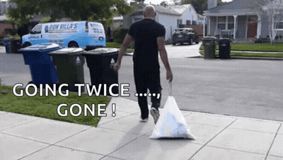 Man Walking With Trash Bag Going Twice Gone GIF