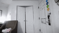 Man Walks Inside Room In Red Adidas Suit GIF