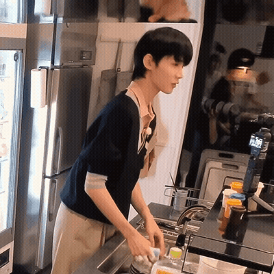 Man Washing Dishes In Kitchen With Coca Cola Bottle GIF