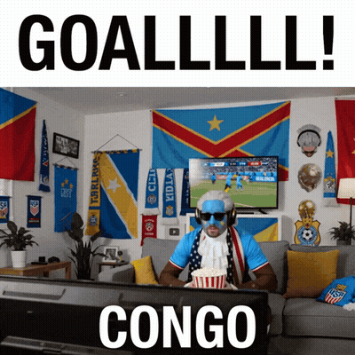 Man Watching Soccer On Couch Saying Congo GIF