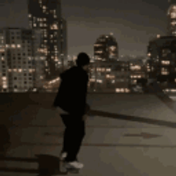 Man Watching Sparkling City Lights GIF