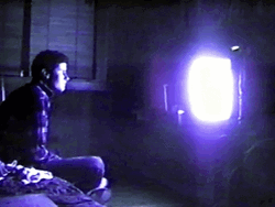 Man Watching TV In Dark GIF