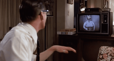 Man Watching TV With Box Of Life GIF