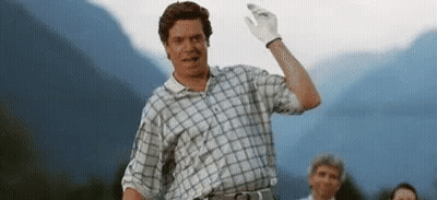 Man Waving In Plaid Shirt And White Glove GIF