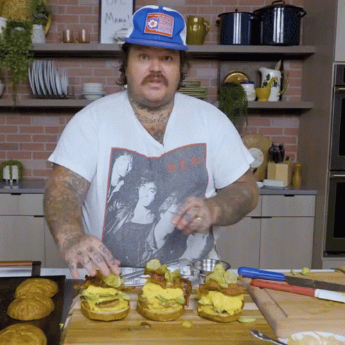 Man Wearing B.E.M. T-Shirt Preparing Food GIF