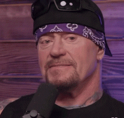 Man Wearing Bandana And Sunglasses Talking Into Microphone GIF