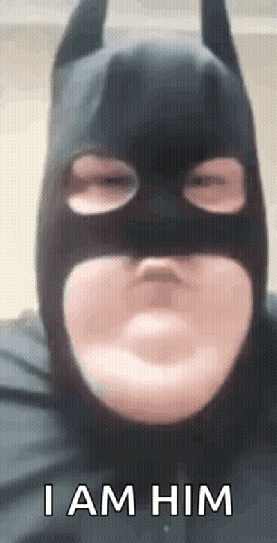 Man Wearing Batman Mask Making Face GIF